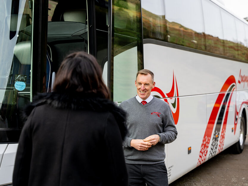 Friendly greeting from the coach driver | Longmynd Travel